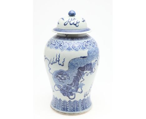 Late 19th century, a baluster shaped jar painted with Dogs of Fo chasing a flaming pearl within leaf, petal and greek key bor