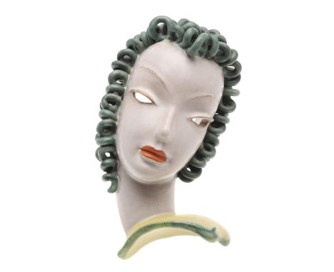 An Art Deco 1930's terracotta wall mask, painted with green ringlets and red lips. Marked to the reverse, 'Goldscheider, Made