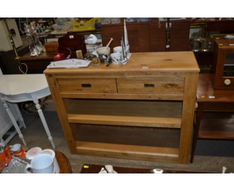 A light oak modern bookcase / dresser fitted two drawers