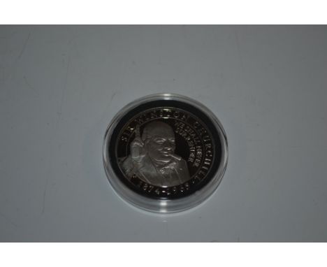 A cased Winston Churchill coin 