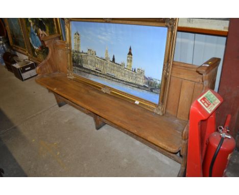 An Arts &amp; Crafts style light oak pew 