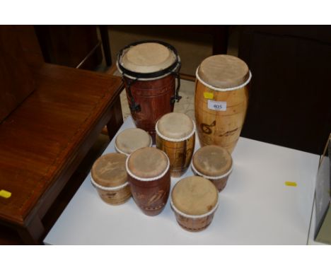 A collection of various small bongo drums