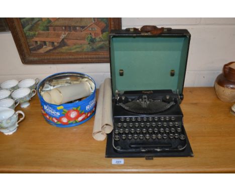 A Monarch portable typewriter and some artists material 
