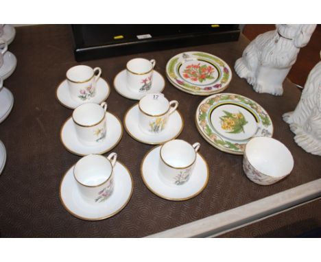 A set of six Royal Worcester coffee cans and saucers with floral decoration and four German porcelain tea plates with floral 