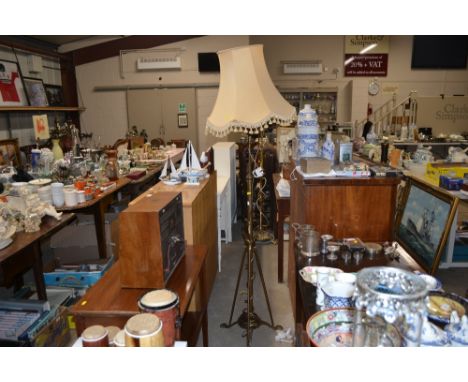 An antique brass lamp standard converted to electricity 