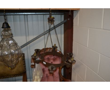 An iron candelabra type pendant light fitting 