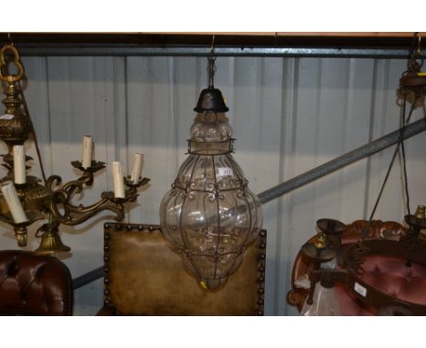 A glass and metal ware baluster shaped hanging ceiling lamp