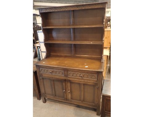 Ercol Welsh dresser with two short drawers, twin cupboard and two shelf back, 120 x 50 x 182 cm