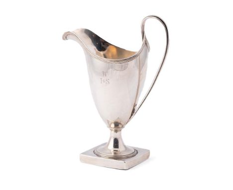 A George III Peter and Anne Bateman silver cream jug, of helmet form, with reeded edge on square pedestal base, monogram engr