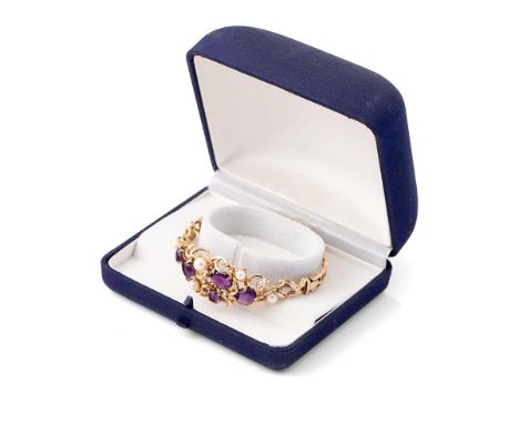 A 9ct gold amethyst and pearl bangle set with five amethysts and four pearls in an organic scrolling design, 21.9g, 5.8 by 5.