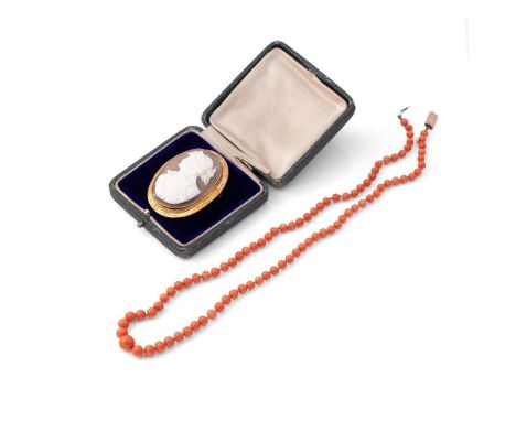 A 9ct gold set cameo brooch, of classical portrait form, the gold frame with beaded edge and engraved detail, 46 by 36mm, 10.