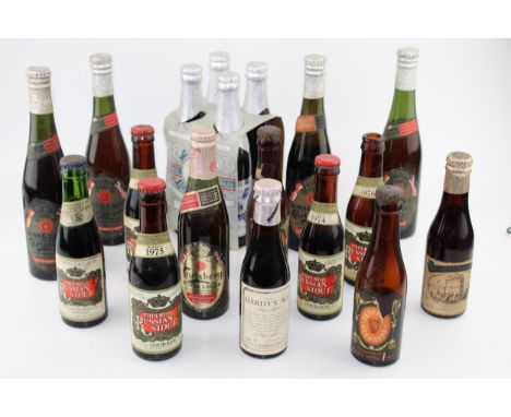 A collection of vintage beer bottles mostly with contents to include special editions by 'Carlsberg' and a 'Festival of Brita
