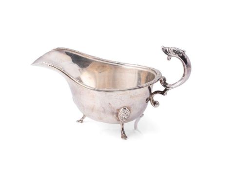 A silver sauce boat, with dragon handle and Celtic knot work rim and three hoofed feet, Deakin and Francis Ltd, Birmingham 19