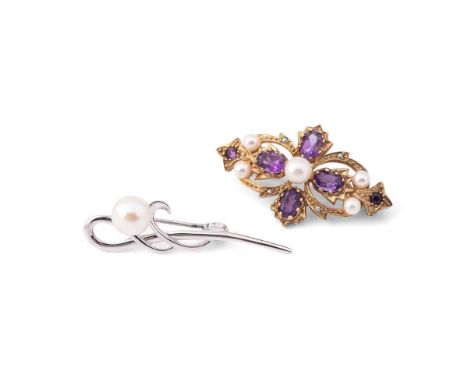 A 9ct gold amethyst and pearl brooch, with central quatrafoil of four oval cut amethysts, with pearl to the centre, further p