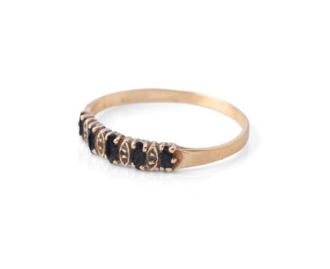 A 9ct yellow gold ring set five sapphires. Ring size R. Weight 1.6g.
