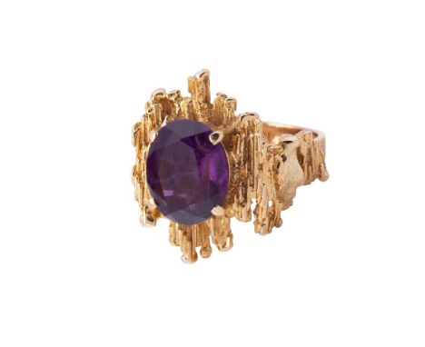 A 9ct gold and amethyst ring of brutalist form circa 1970, the oval cut amethyst of approximately 12 by 10mm, size L/M, 9.5g 