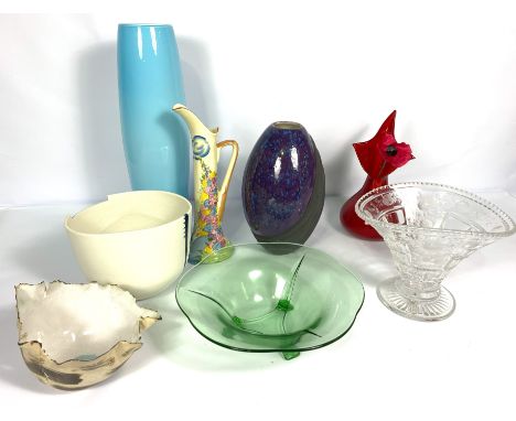 A group of assorted decorative glass and ceramic studio vases, including a tall ovoid purple blue lustre vase; a light blue g