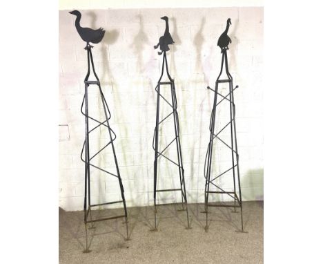 Three vintage wrought iron garden obelisks, each surmounted by a novelty duck (3)