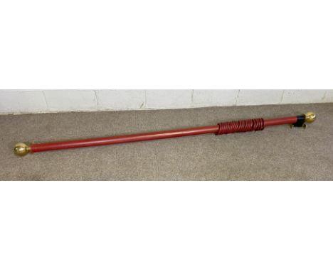 A vintage curtain pole with heavy brass finials and 12 rings, 230cm x 6cm diameter.