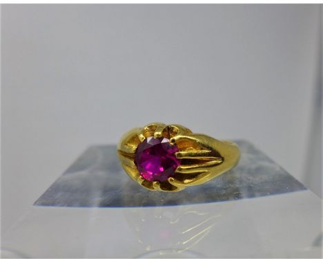 A 22ct yellow gold ring multi claw-set to the centre with a round faceted natural Burmese ruby dia: 5mm, Size: Q 1/2, 9.6g 