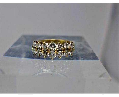 An 18ct yellow gold diamond ring composed of two graduated rows of round brilliant-cut diamonds, Size: K 1/2, 3.3g 