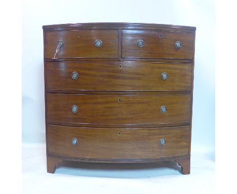 A Regency mahogany bow front chest of drawers, raised on bracket feet, H.106 W.107 D.58cm 