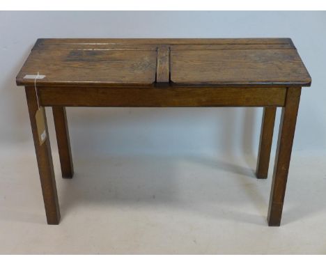 A late 19th/early 20th century oak stool with 2 hinged compartments, H.62 W.92 D.35cm 