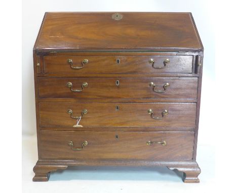 A 19th century mahogany bureau, having compartmentalised interior above an arrangement of four long drawers, on bracket feet,