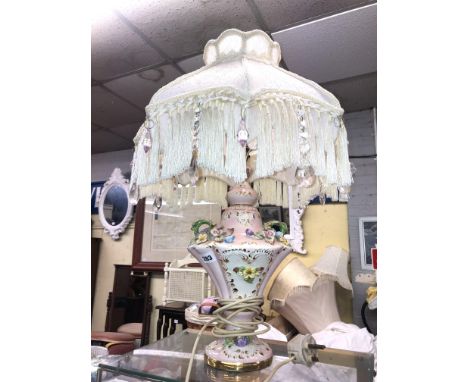 PINK FLORAL ENCRUSTED POTTERY TABLE LAMP AND SHADE AND A PAIR OF CAPO STYLE LAMPS