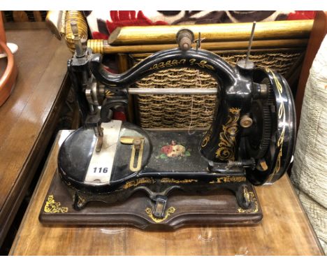VINTAGE BLACK ENAMEL AND GILDED SEWING MACHINE