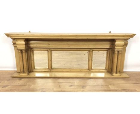 Classical style pine shelf, of breakfront form, with projecting cornice raised on fluted columns and three bevelled mirrored 