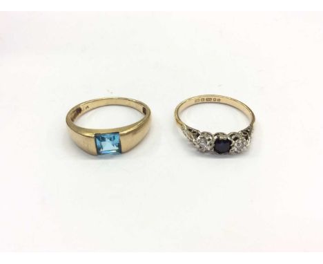 Two 9ct gold rings to include sapphire and diamond three stone ring in illusion setting, size M and a blue topaz ring, size N