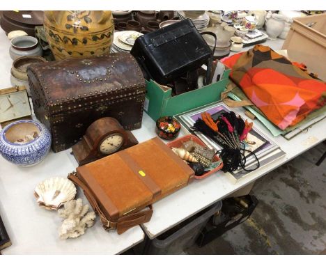 Sundry items, including camera accessories, a studded leather trunk, a clock, shells, a portfolio of pictures and art supplie