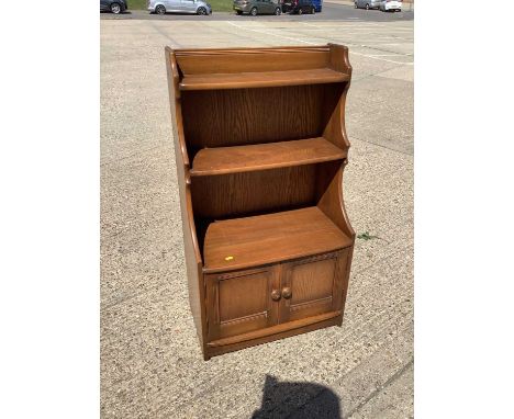 Ercol bookcase with cupboards below, 61cm wide, 34cm deep, 111cm high