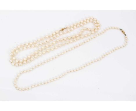 Cultured pearl necklace with a string of 5.5 to 5.9mm cultured pearls on gold clasp, 63cm long, and a simulated pearl necklac