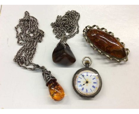 Amber brooch, silver mounted amber pendant on silver chain, silver fob watch and agate pendant on chain
