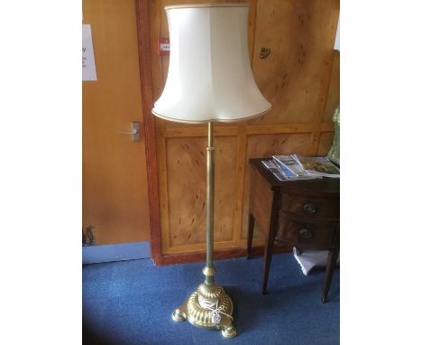 Victorian brass standard lamp, with adjustable column, lobed circular base on conforming feet