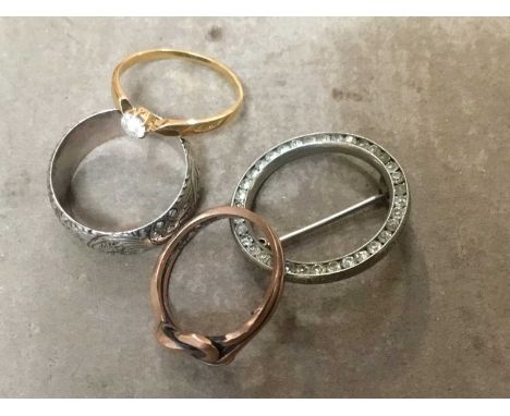 Diamond single stone ring, 9ct rose gold knot ring, silver engraved ring and a paste set broochCondition report: Diamond ring