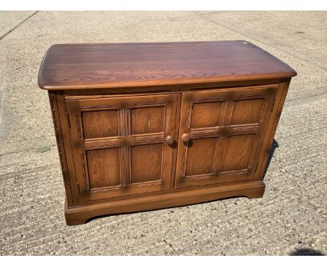 Ercol music unit with rising lid and doors below, 104cm wide, 49cm deep, 70cm high
