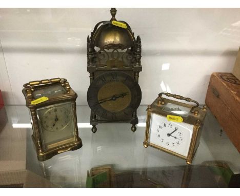 Two carriage clocks together with a brass lantern style clock (3)