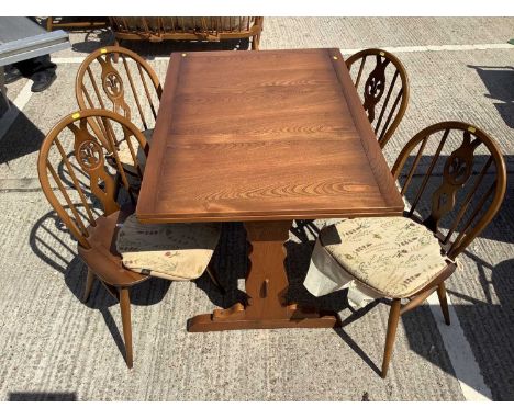 Ercol draw leaf dining table and set of four chairs