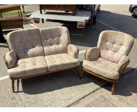 Ercol two seater settee and a matching armchair