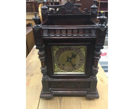 Late 19th century mantel clock with 8 day striking movement by Winterhalder &amp; Hofmeier, in carved oak case with galleried