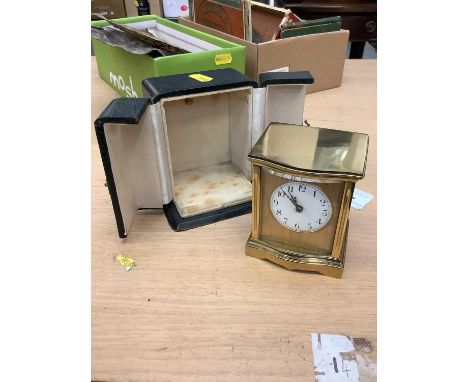 Early 20th century French brass cased carriage clock with circular white enamel dial, in original leather covered case