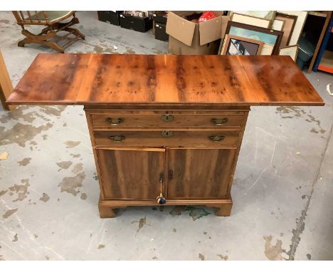 Georgian -style yew wood veneered cupboard with drop flaps, two drawers and two cupboard doors below on bracket feet 84 cm wi