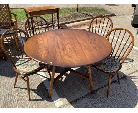 Ercol drop leaf dining table and a set of four stick back chairsCondition report: 62cm with flaps down opening to 126cm x 114
