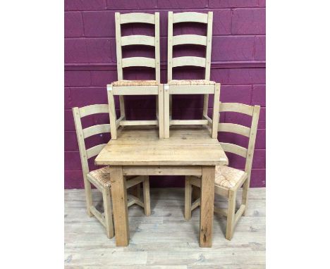 Contemporary light oak dining table and four matching ladder back chairs with rush seats
