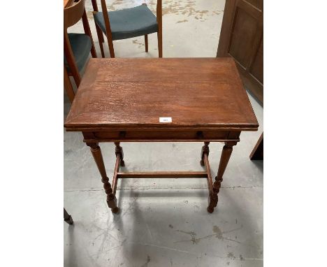 Oak card table with folding top and single drawer on turned and tapered legs joined by stretchers