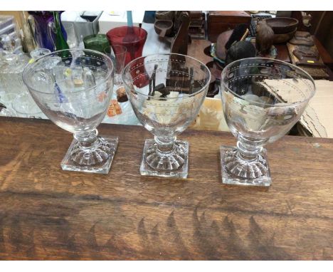 Three 19th century glass rummers, with lemon squeezer bases, etched with a star and circle patternCondition report: One glass