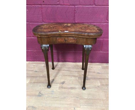 Walnut veneered kidney shape card table with fold over revolving top and drawer below on cabriole legs, 76cm wide, 74.5cm hig
